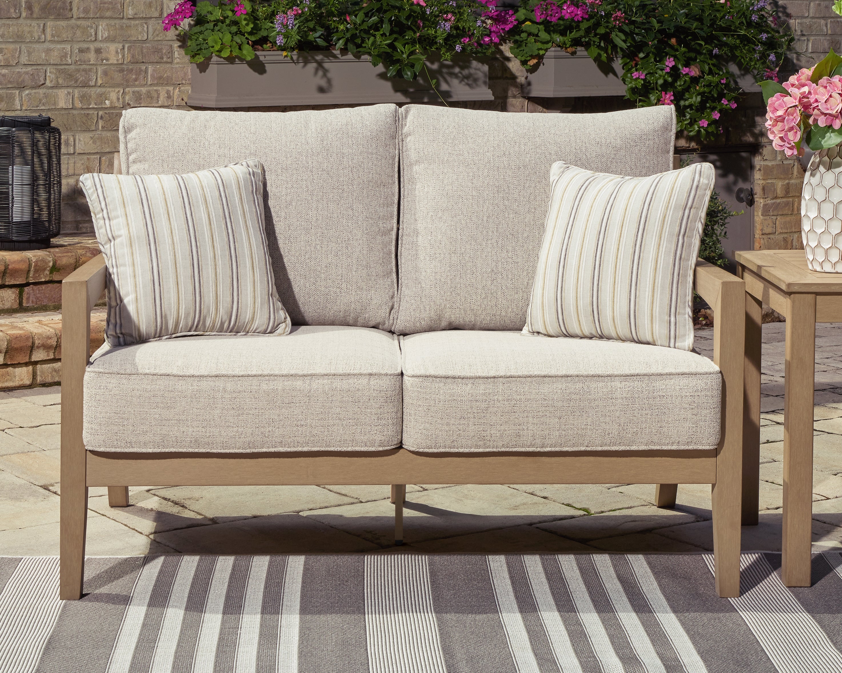 Furniture City Laplace - Ashley Furniture - Hallow Creek Outdoor Loveseat with Cushion - Loveseat w/Cushion - P560-835