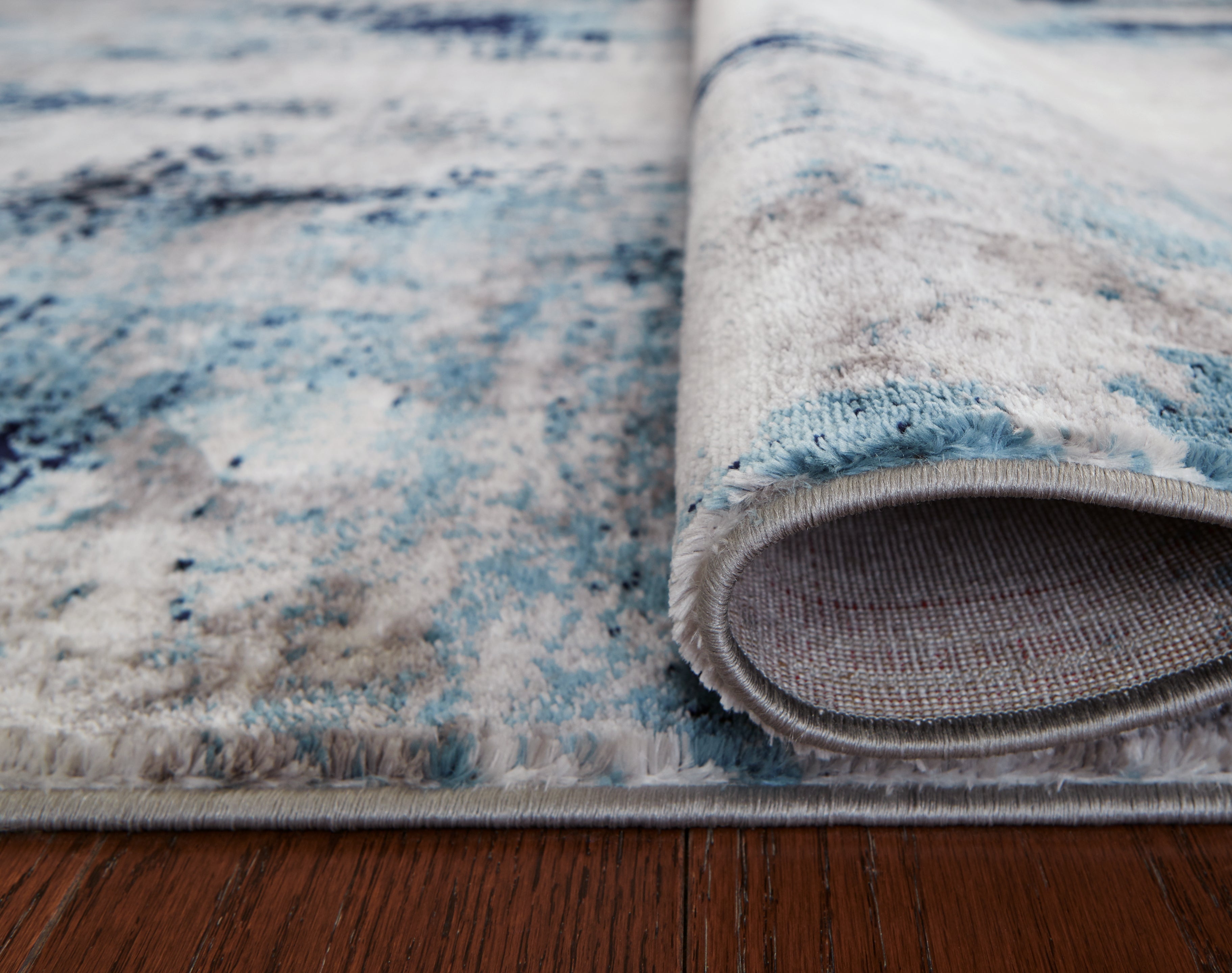 Furniture City Laplace - Ashley Furniture - Leonelle Rug - 7'10" x 10' Rug / White/Blue/Gray - R404871