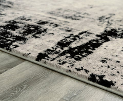 Furniture City Laplace - Ashley Furniture - Zekeman Rug - 5'3" x 7'7" Rug / Black/Cream/Gray - R404922